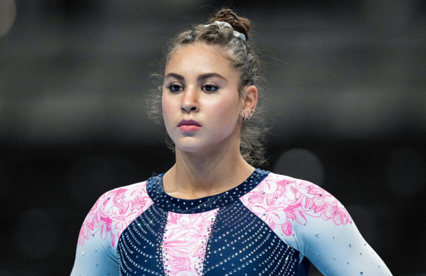 The former US gymnast says she suffered an anaphylactic reaction in the Olympic Village